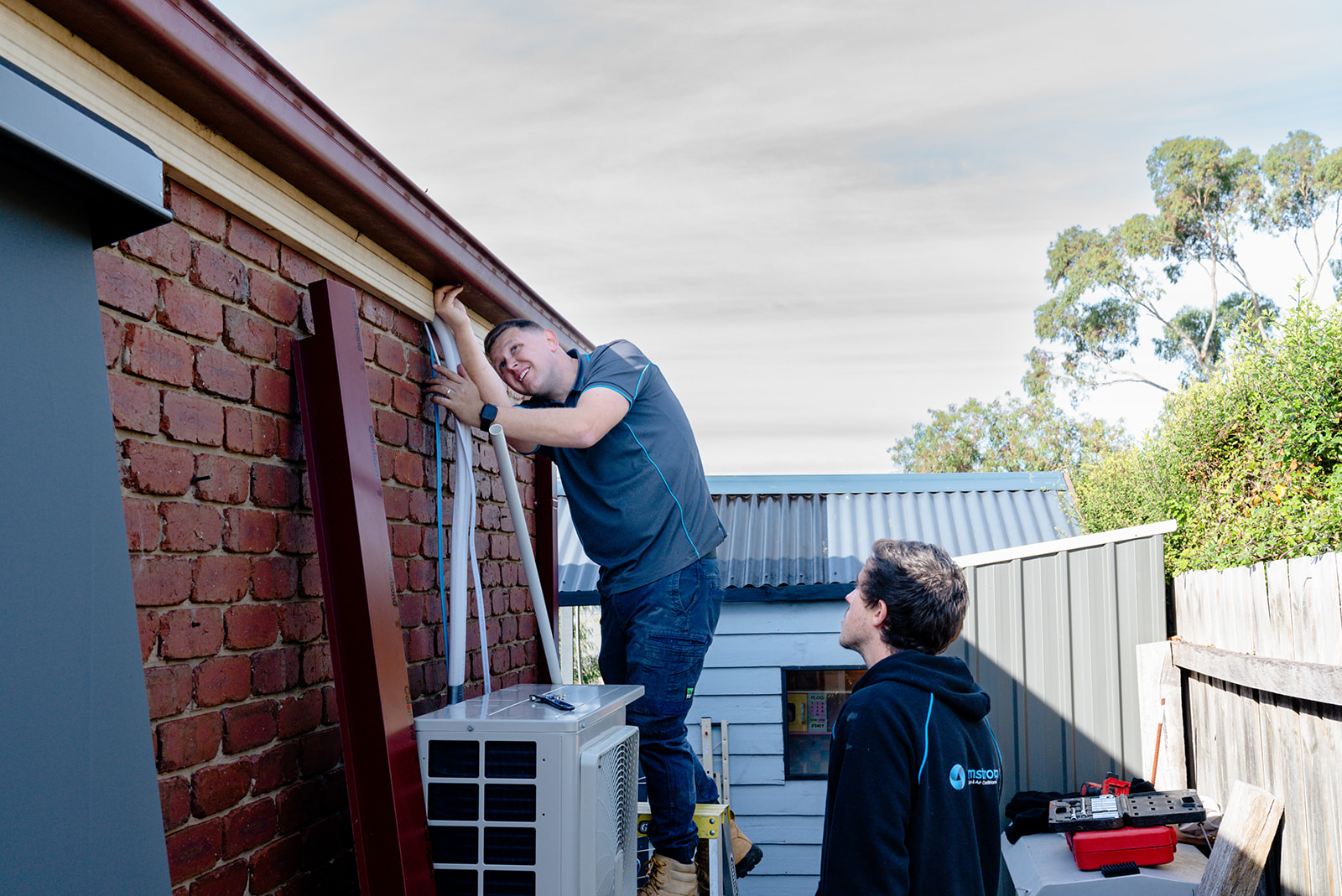 Armstrong Air employee working on installation