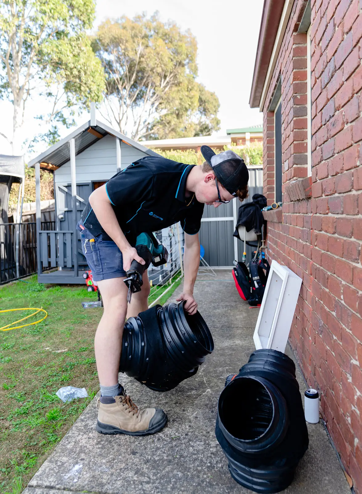 Armstrong Air employee working on installation